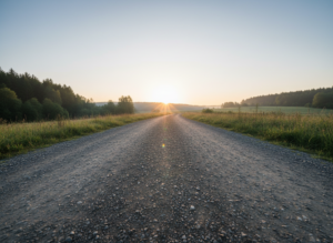 Wyraźna, spokojna ścieżka w naturze, prowadząca ku jasnemu horyzontowi, symbolizująca podróż odchudzanie.